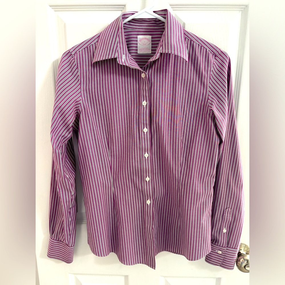 Like new Brooks Brothers woman’s dress shirt. No iron size 2; NWO tags